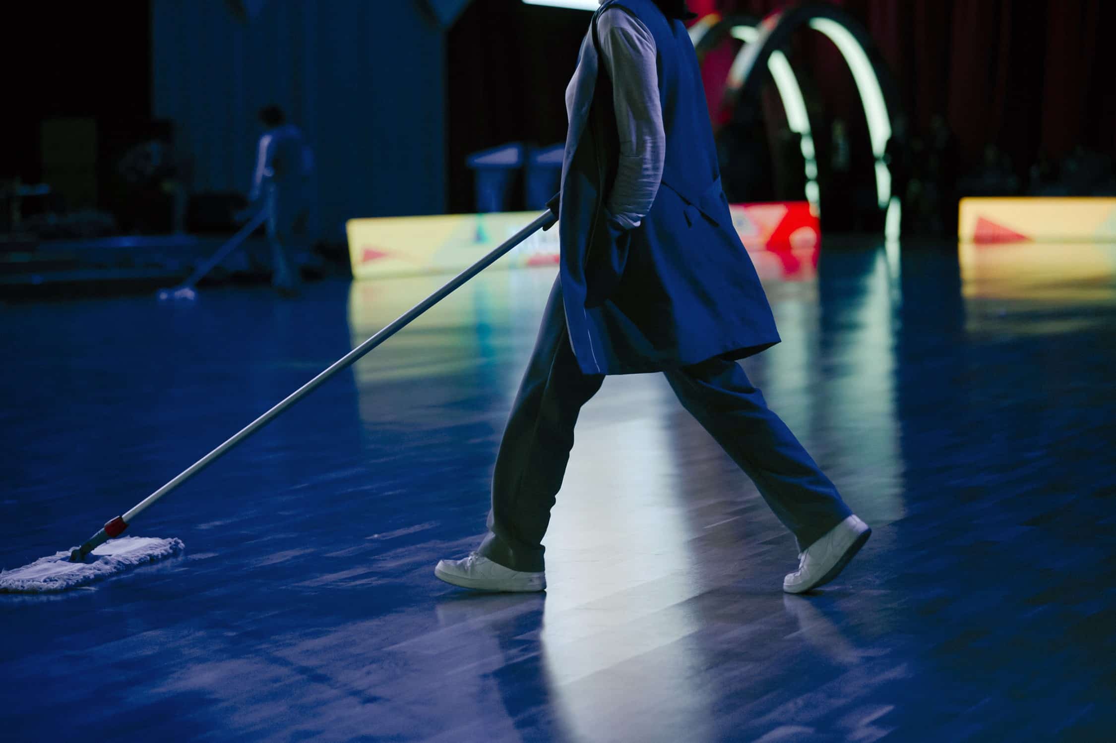 cleaning a dance floor after an event.